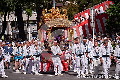 Procession of Kagura Yakata, small altars decorated with gold leaf, during Nagoya festival. Japan Editorial Stock Photo