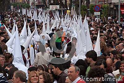 Processions wrapped by a multitude of devotees ,Seville,16-04-2017 Editorial Stock Photo