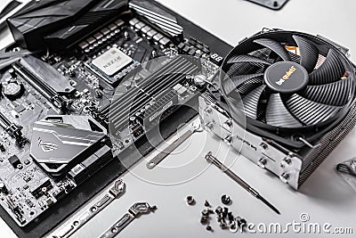 Processor Ryzen 7 2700X against the background of a computer motherboard Asus rog crosshair vii hero, and cooler be Editorial Stock Photo