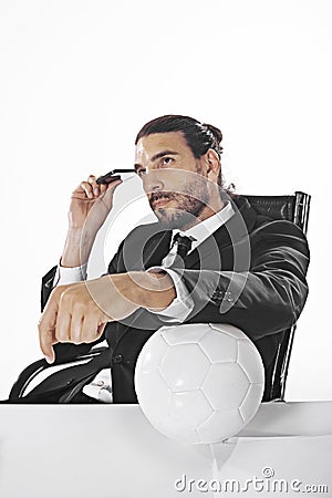 Procurator business man bets on a football match in office Stock Photo