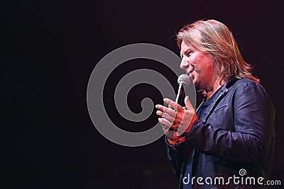 Producer Viktor Drobysh talking to the microphone on stage during the Viktor Drobysh 50th year birthday concert at Barclay Center Editorial Stock Photo