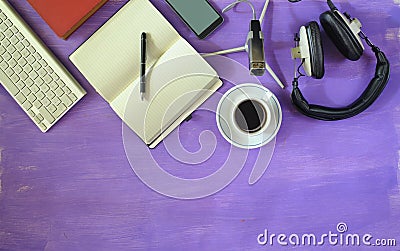 Producing podcast with stylish headphones,vintage microphone,coffee,smartphone,computer keyboard on purple table.Flat lay with Stock Photo