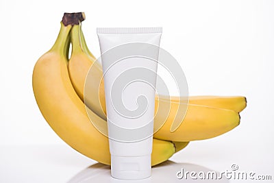 Product branding concept. Photo of fresh bio vitamin facial cleanser with yellow banana extract essence isolated over white Stock Photo