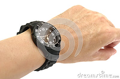 A product photo taken on a black wrist watch worn around a wrist Stock Photo