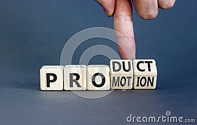 Product and promotion symbol. Concept words Product and promotion on wooden cubes. Businessman hand. Beautiful grey table grey Stock Photo