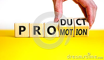 Product and promotion symbol. Concept words Product and promotion on wooden cubes. Businessman hand. Beautiful yellow table white Stock Photo