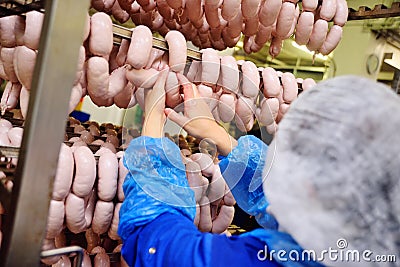 Production of boiled sausages and smoked sausage at a meat factory Stock Photo