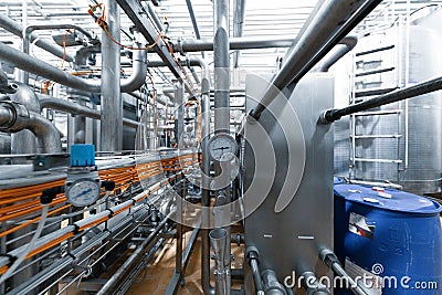 Chrome-plated pipes, pressure sensors, wires and devices. Industrial background Stock Photo