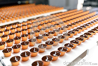 Production of pralines in a factory for the food industry - auto Stock Photo