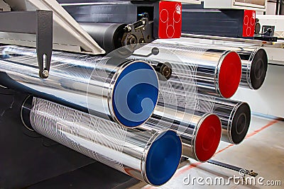 Production of white polypropylene flat yarn for the production of industrial bags. The shafts are spinning. Cellophane Stock Photo