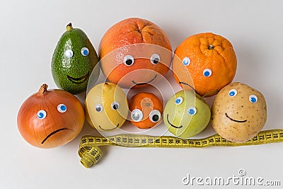 Products characters with funny faces and Measuring tape on white background. Diet concept Stock Photo