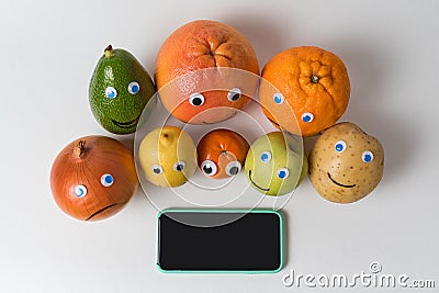 Products characters with funny faces and smartphone with black screen. Application for weight loss, concept Stock Photo