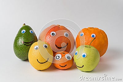 Products with funny faces Googly eyes and painted smiles. Different nationalities concept Stock Photo