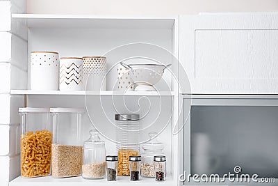 Products and houseware on shelves Stock Photo