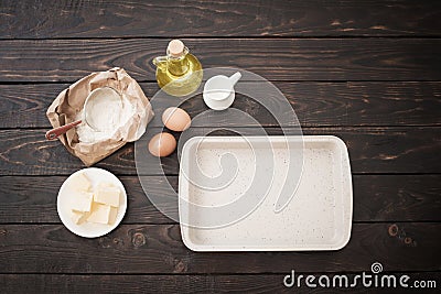 the products for its preparation dough on dark wooden background Stock Photo