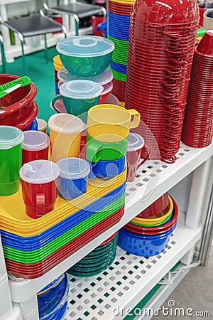 The products of plastic ware, subjects of care of plants on display in a supermarket. Replacement of disposable tableware Stock Photo