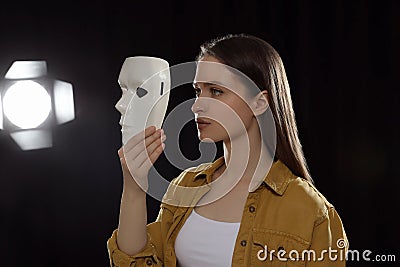 Professional actress rehearsing with mask on stage Stock Photo