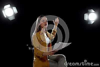 Professional actress rehearsing on stage in theatre Stock Photo