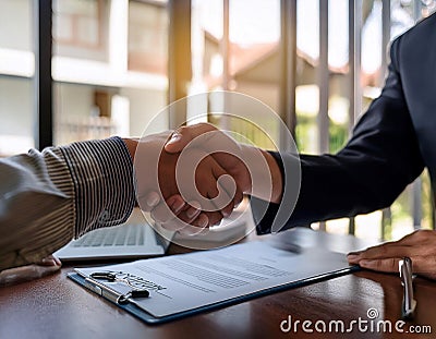 Professional agent and client interaction featuring elements like a handshake, business card, and contract symbolizing Stock Photo