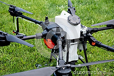 Professional agriculture drone on the green field Editorial Stock Photo