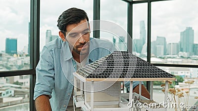 Smart architect engineer check, inspect, look architectural model. Tracery Stock Photo