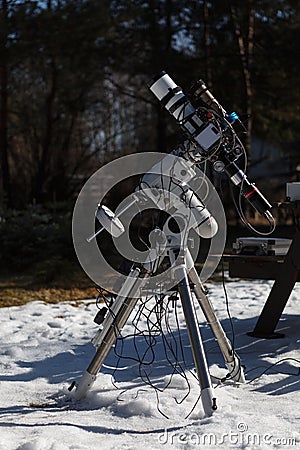 Professional astrophotography telescope equipped with guider scope and astro camera Stock Photo