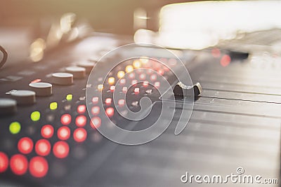 Professional audio mixing console with faders and adjusting knobs - radio Stock Photo