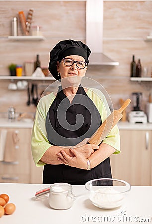 Professional baker smiling at camera Stock Photo