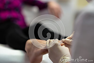 Professional beautician making a pedicure Stock Photo