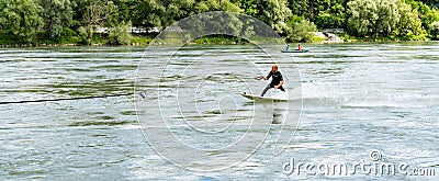 Professional bungee surfer Sebastian Dessecker bungee surfing on the Rhine near Bad Saeckingen Editorial Stock Photo