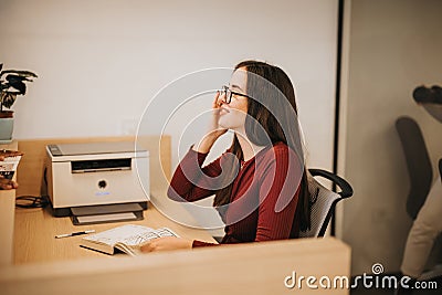 Professional businesswoman explaining property costs to a clients prepared to sign the buying contract. Stock Photo