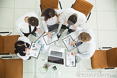 Professional business team developing a new financial strategy of the company at a work location in a modern office Stock Photo