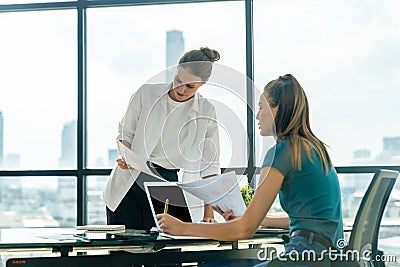 Businesswoman discuss about financial plan by using statistic document. Tracery. Stock Photo