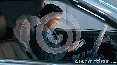 Professional car mechanic working in modern auto repair service and checking engine Stock Photo