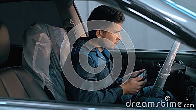 Professional car mechanic working in modern auto repair service and checking engine Stock Photo