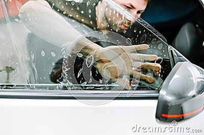 Man working in a a garage Editorial Stock Photo