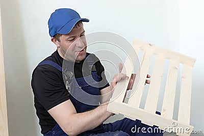 Professional carpenter. Wooden slats and working tools. Production of wood products Stock Photo