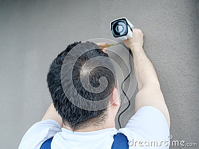 Professional CCTV technician working Stock Photo