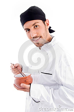 Professional chef holding bowl and chopstick Stock Photo