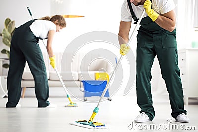 Professional cleaning crew washing floor Stock Photo