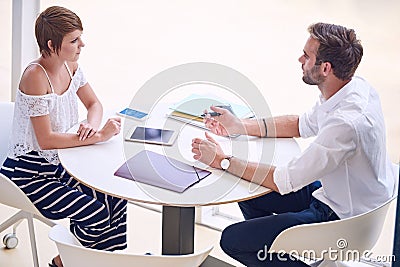 Professional consultant giving business advise to aspirational businesswoman Stock Photo