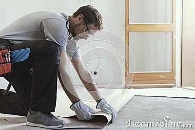 Contractor removing an old linoleum flooring Stock Photo