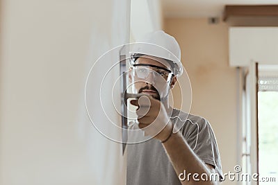 Professional craftsman applying plaster with a trowel Stock Photo