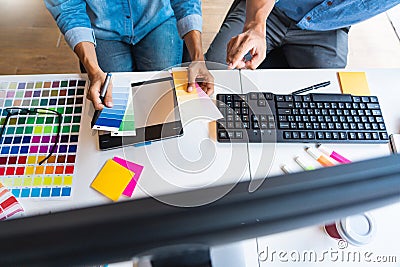 Professional Creative architect graphic desiner occupation choosing the Color pantone palette samples for project on office Stock Photo