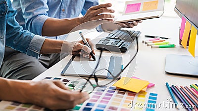 Professional Creative architect graphic desiner occupation choosing the Color pantone palette samples for project on office Stock Photo