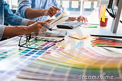 Professional Creative architect graphic desiner occupation choosing the Color pantone palette samples for project on office Stock Photo