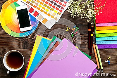 Professional creative graphic designer desk on wooden background top view Stock Photo
