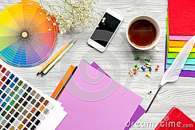 Professional creative graphic designer desk on wooden background top view Stock Photo