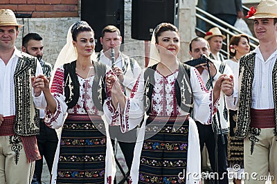 Professional dancers in folk costume from ,TÃ¢rgu Ji. 4 Editorial Stock Photo