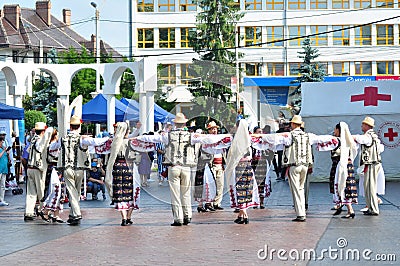 Professional dancers in folk costume from ,TÃ¢rgu Ji. 8 Editorial Stock Photo